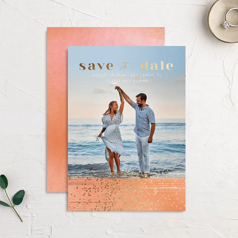 A dance on the beach-themed save-the-date card