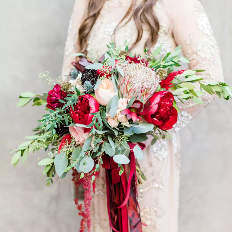 Autumn wedding bouquet in jewel tones with proteas
