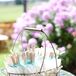 Jen handmade the ceremony programs which doubled as fans, perfect for a sunny summer day in California, and were set in a rustic wire basket with burlap lace bunting.