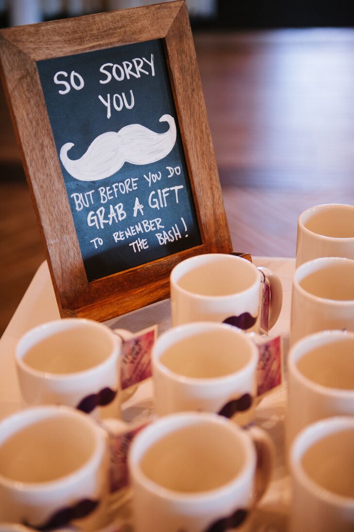 Since "Hot Rod" is  a favorite movie of Jennifer and Mario, they decided to give their guests mugs with mustaches on them as favors. The sign next to the favor display read, "Sorry you mustache, but before you do, grab a gift to the remember the bash!"