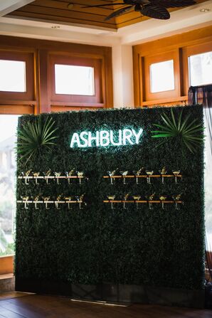 Modern Greenery Wall with Cocktails and Lit Sign