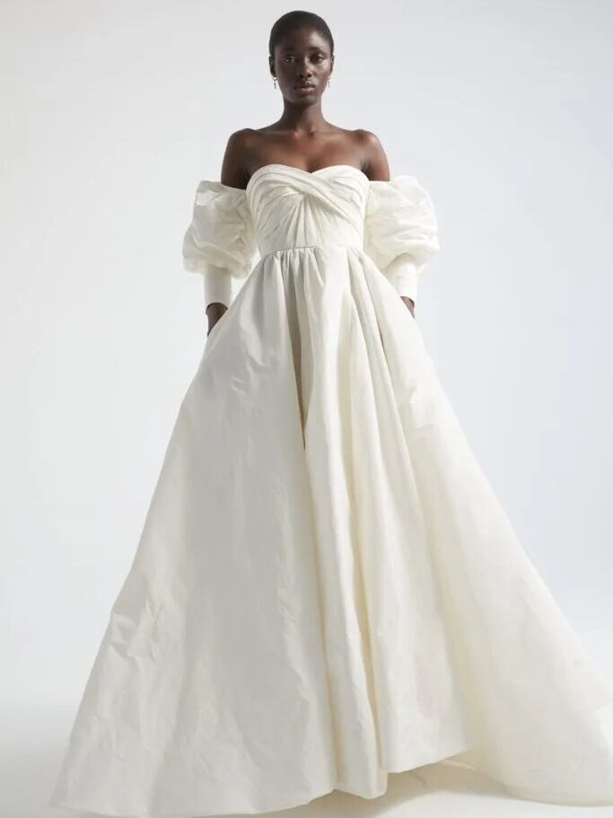 Model wears a wedding dress by Spanish designer YolanCris. 