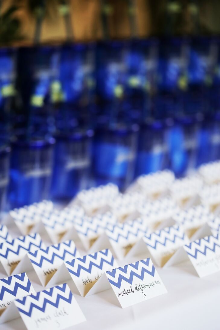 "We both gravitate toward a more modern, architectural aesthetic," says Courtney, who applied the eye-catching chevron pattern in cobalt blue to the escort cards.