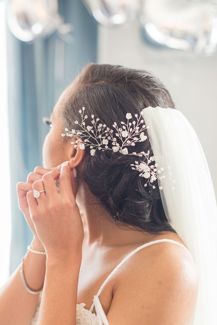 Bride Putting on Earrings for Wedding at The Faulkner in Jackson, Mississippi