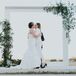 Sleek Vine-Covered Metal Wedding Arch