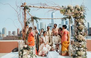 Elegant Hindu Ceremony Beneath Birch Mandap Covered with Romantic Flowers