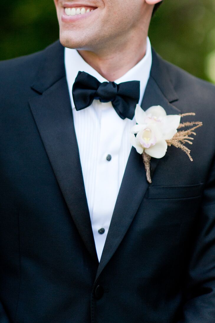 Lou's boutonniere featured a small arrangement of white orchids.