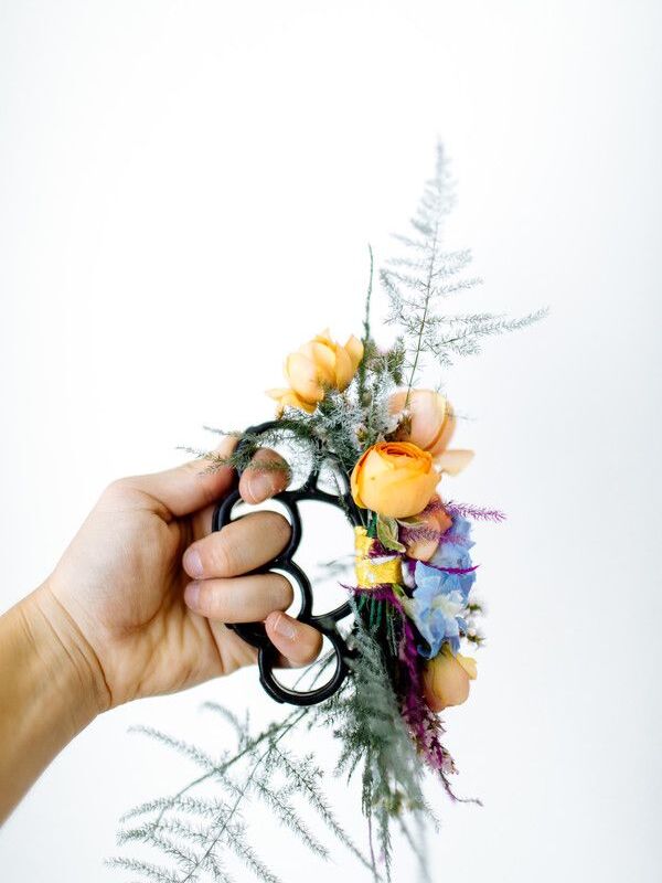 Brass knuckles decorated with flowers