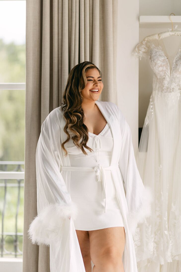 Bride in White Mini Dress, White Robe and Glam Makeup Getting Ready
