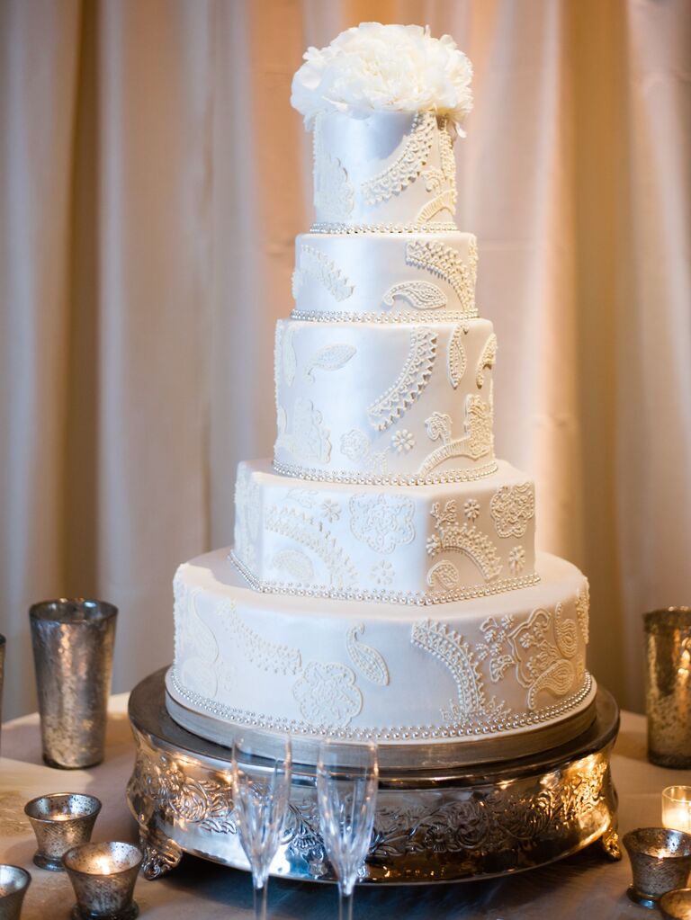 elegant five tier wedding cake with white satin finish and lace appliques