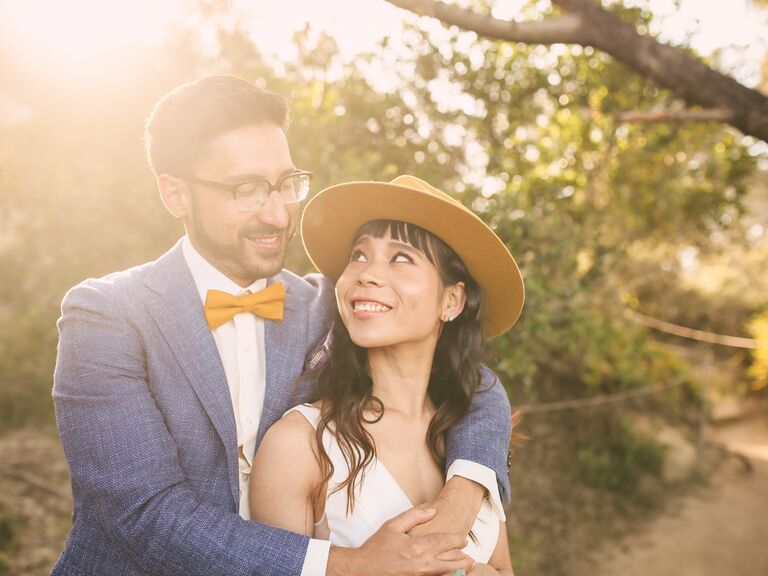 The happy couple gaze into each other's eyes for their engagement photoshoot