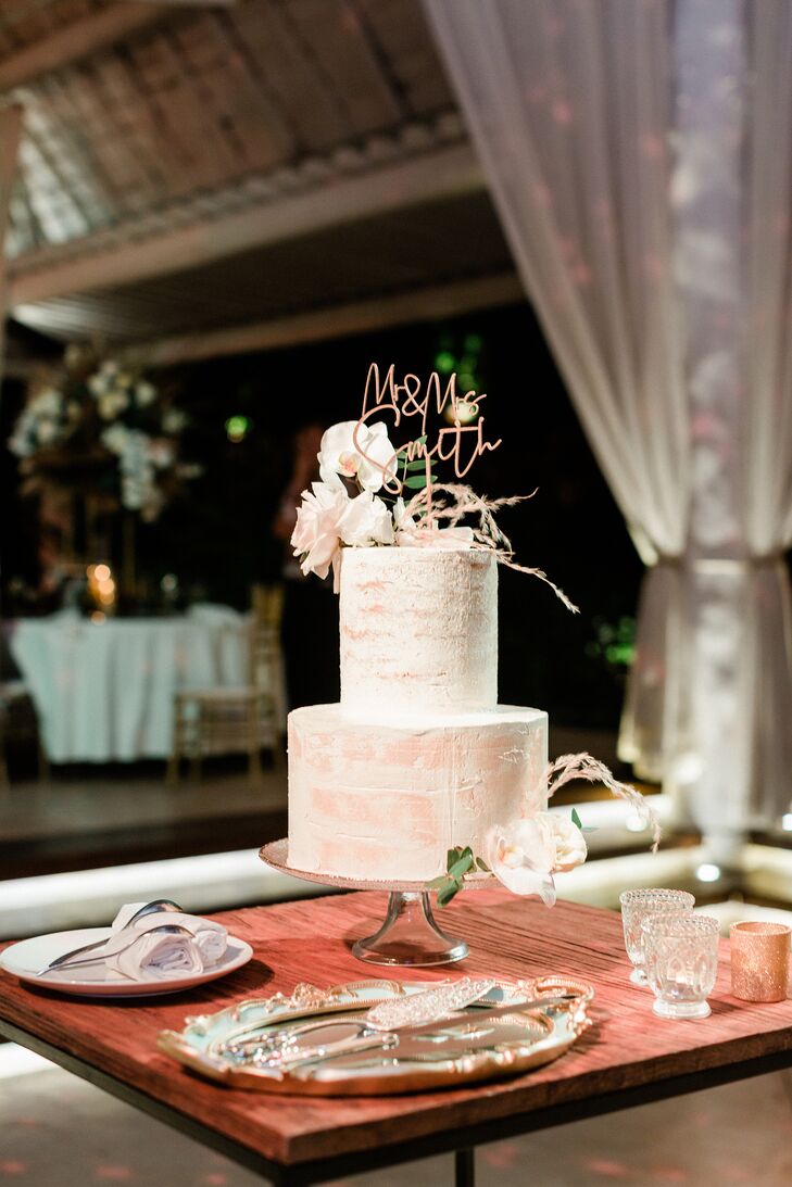 Two-Tier White-and-Orange Wedding Cake With Mr. and Mrs. Cake Topper