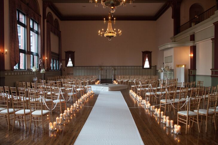 The ceremony in the round was set up in the grand ballroom of Germania Place in Chicago. Candles glistened along the aisles, strategically placed under the crystal chandeliers.