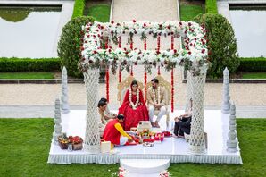 Bride and Groom Under Mandap During Indian Wedding at Oheka Castle in Huntington, New York