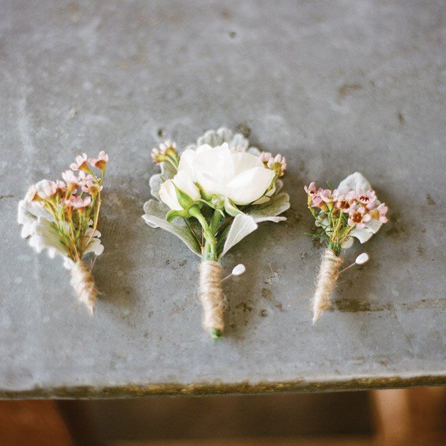 Spray roses, wax flowers and dusty miller loosely wrapped in twin had a natural look.