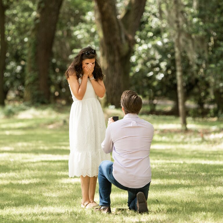 Man proposing to woman at Charlestowne Landing in Charleston, South Carolina
