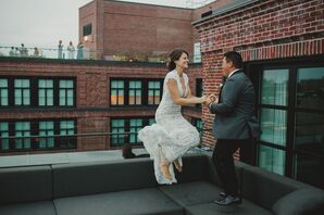 Couple Jumping and Holding Hands During Reception at The Line Hotel in Washington, DC