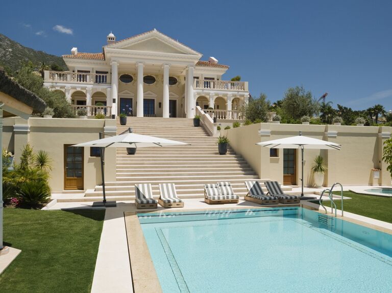Luxurious Spanish villa perched on a hillside with a private swimming pool. 