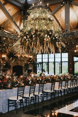 Modern Rustic Reception with String Lights and Hanging Flower Installation