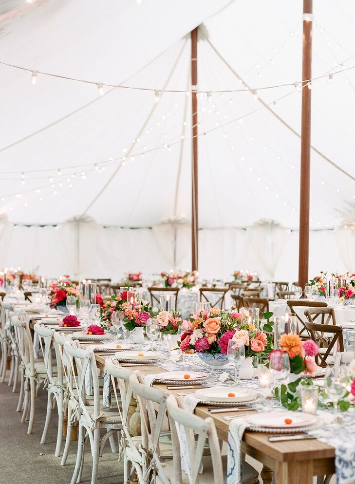 Romantic Tented Reception with Farm Tables and Flower Centerpieces