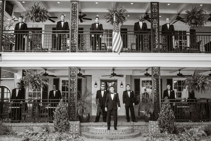 The groom and groomsmen wore Jos. A Bank classic black tuxedos with white wing collar shirts, black bow ties and cummerbunds.