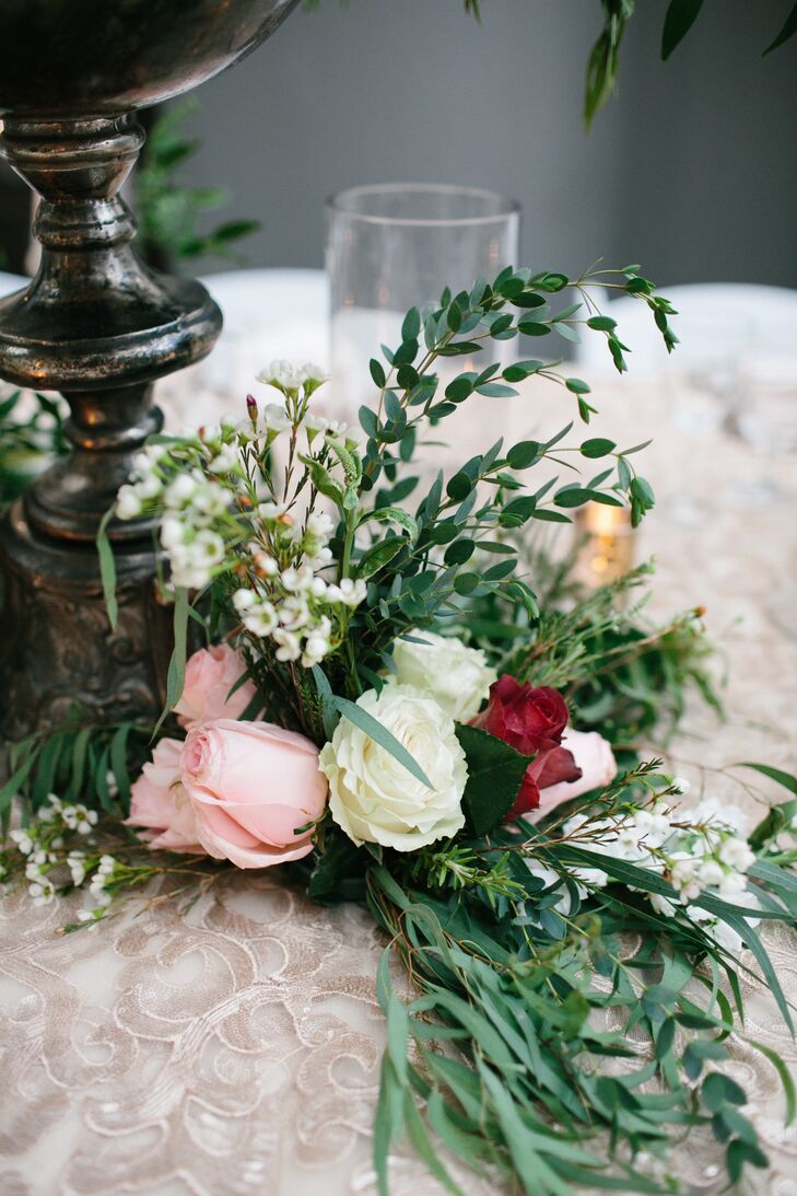 The towering centerpieces were also decorated with roses and leaves on the tables. Brianna from Modern Designs and Concepts really focused on the details when it came to Claire and Rob's reception at Historic Riverside Building in Rochester, Minnesota.