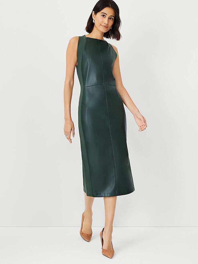 Model wearing a dark green faux leather midi dress