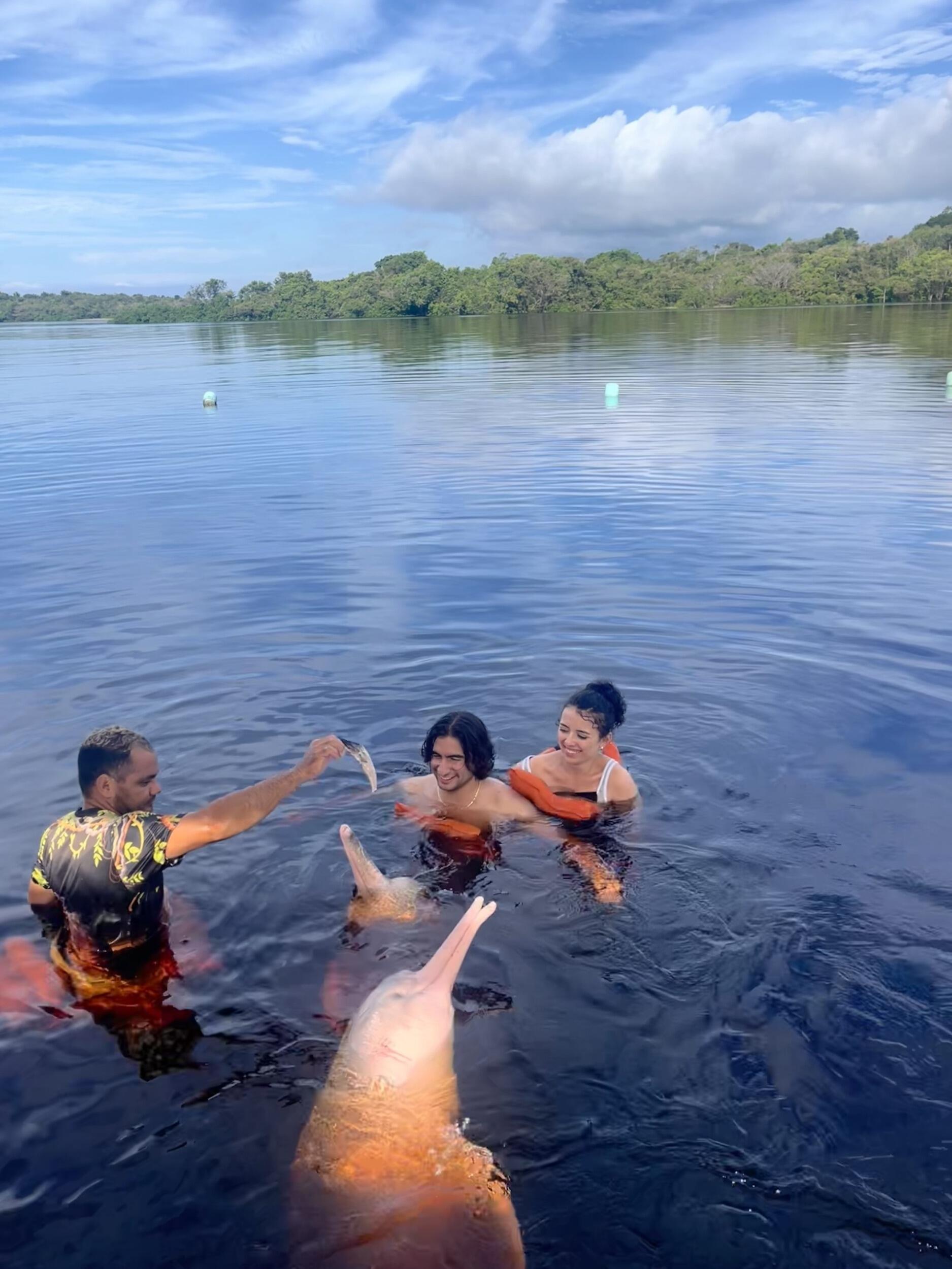 A decade together—celebrated in Brazil, swimming with pink dolphins in the Amazon.