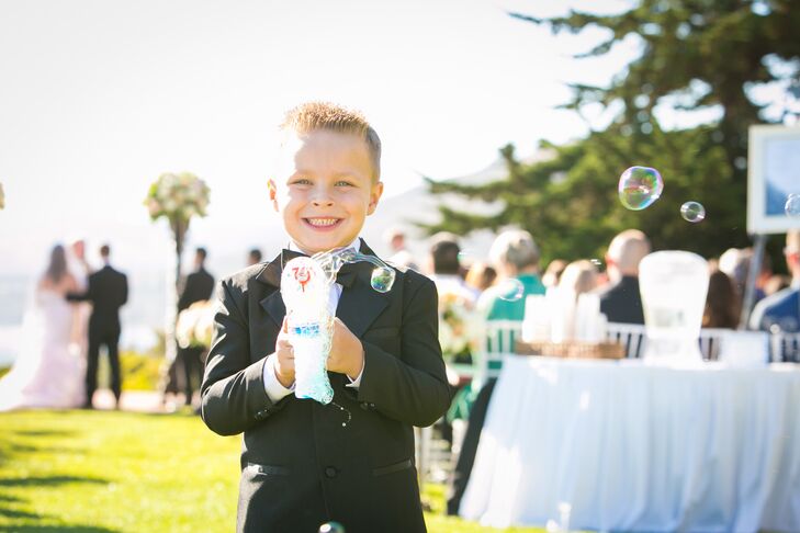 Ring Bearer Blowing Bubbles at Ceremony