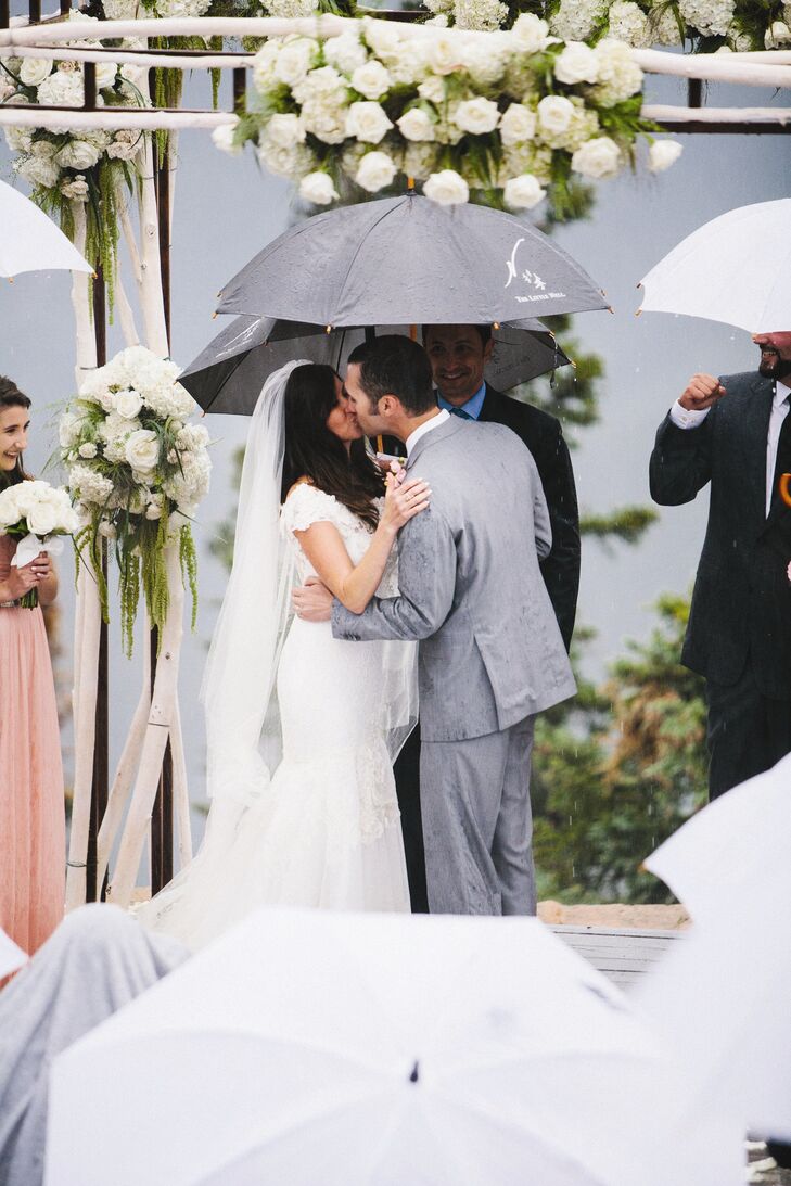 Right before the ceremony started there was a cloud burst followed by sheets of rain.  They wanted to move the ceremony doors, but I wasn’t going to have it.  I knew our guests were comprised of a misfit pack of snowboards, ranchers, New Yorkers, and Navy SEALs.  They could take it and we were going outside, Rachel says.