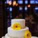 Large yellow gerbera daisies decorated the three tier white cake.