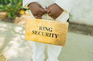 Ring Bearer Holding Gold Ring Security Briefcase for South Carolina Wedding