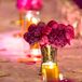 Arrangements of fuchsia peonies sat among the gold pillar candles. The bright florals spoke for themselves, without any additional flowers in the arrangements.