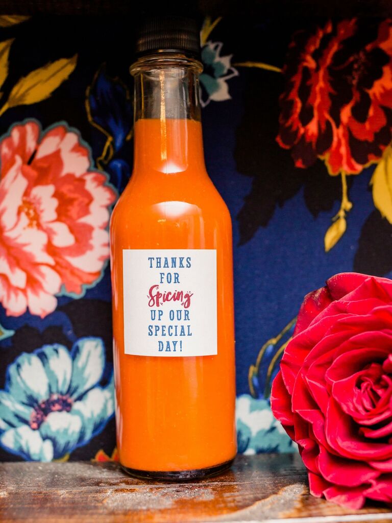 Bottle of red hot sauce with a custom label. 
