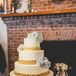 The white wedding cake for dessert was decorated with blue hydrangeas and accents of sweetgrass basket weaving, a craft native to the lowcountry regions. The cake was displayed on an antique white cake stand on a blue and white cake table.