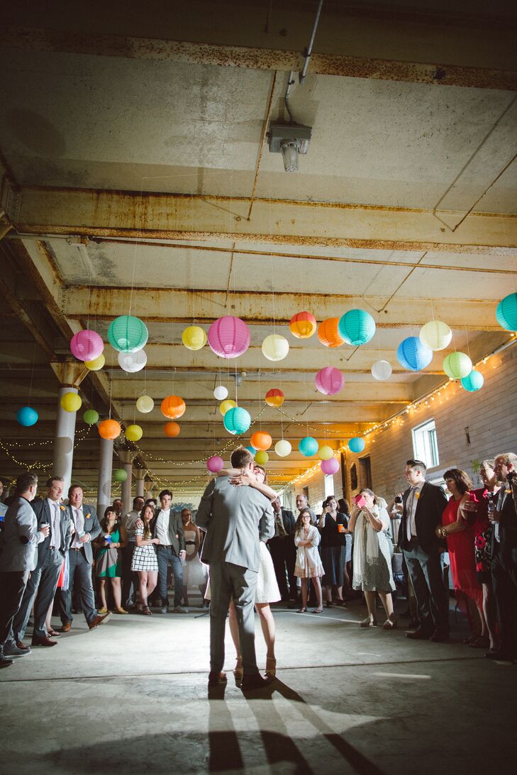 Bernice and Jason hung colorful paper lanterns over the dance floor to make the raw industrial space feel full and bright.