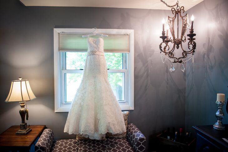Amber wore a strapless fit-and-flare Mori Lee dress with a blush sash. The dress included a lace caplet that she wore for the ceremony but removed for the reception.