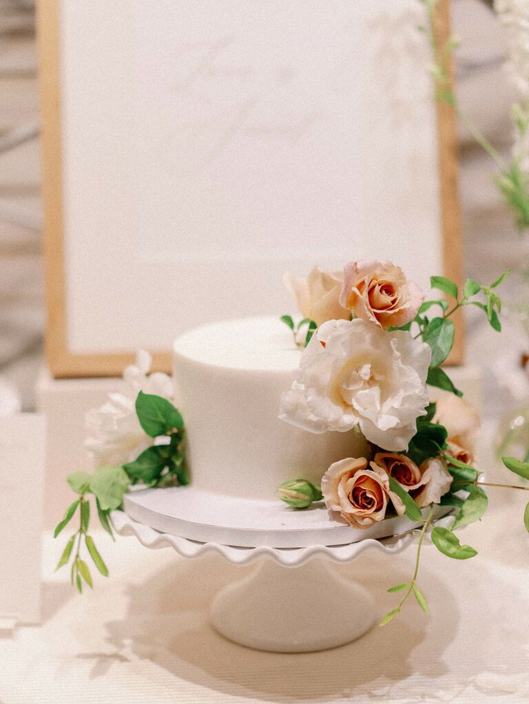 elegant one tier wedding cake with white and blush roses 