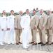 Military Uniform and Tan Suit Groomsmen Attire