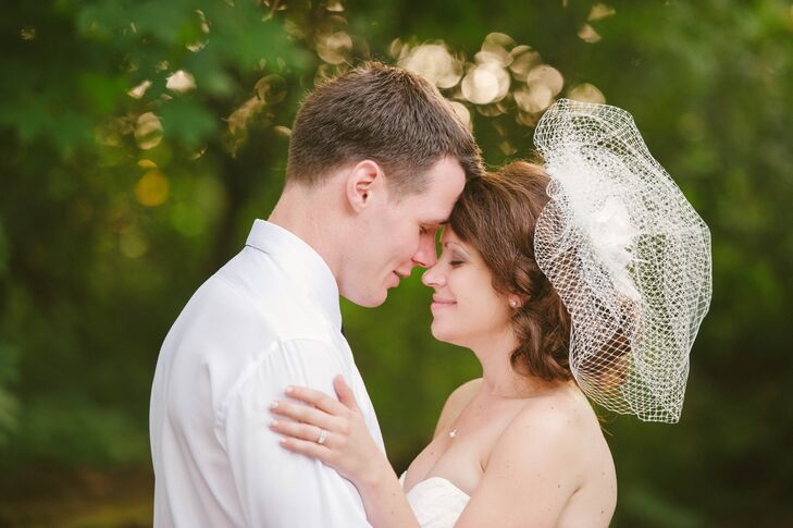 Katie topped off her vintage look with a birdcage-style veil, while Garret opted for a skinny black tie. "Garret and I both like a bit of a vintage look, which also matched well with our venue," Katie says.