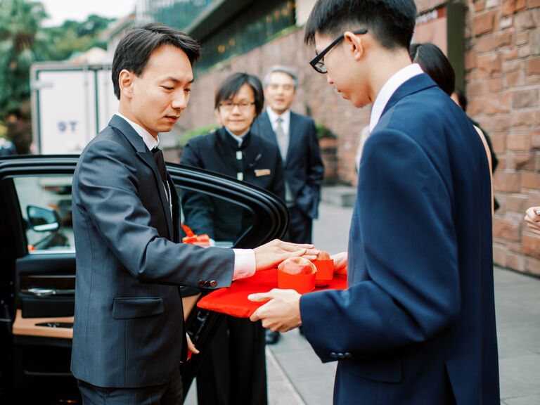 Touching apple during Chinese wedding