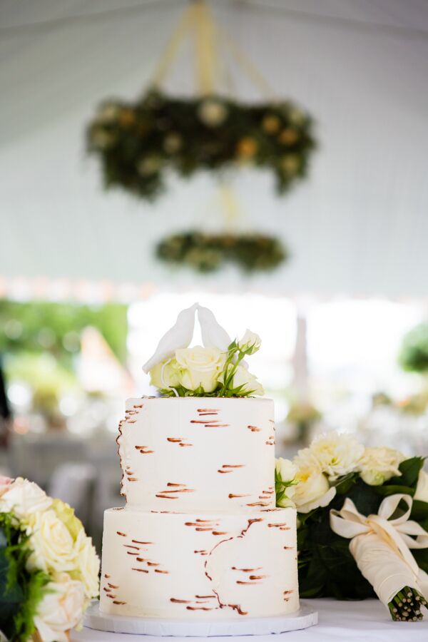 The white wedding cake resembled the look of a white birch tree, with a lovebird topper carved out of wood by a family member. In addition to the cake, guests helped themselves to the ice cream bar provided by Olympic Mountain Ice Cream.