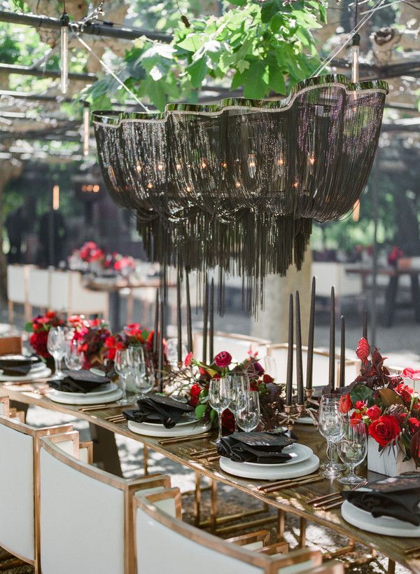 Dramatic black chandelier at wedding reception
