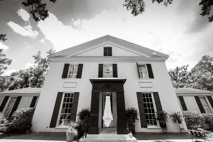 The bride wore a strapless lace gown with a sweetheart neckline and trumpet skirt.