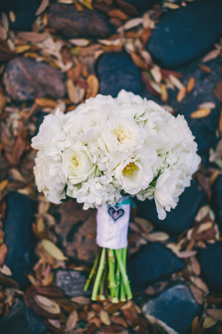 "I was absolutely obsessed with all-white flowers and some greenery," Christina says. "I loved the simplicity of the look, and I felt that it made a statement without taking over our pictures or being too busy. I was so happy with my choice."