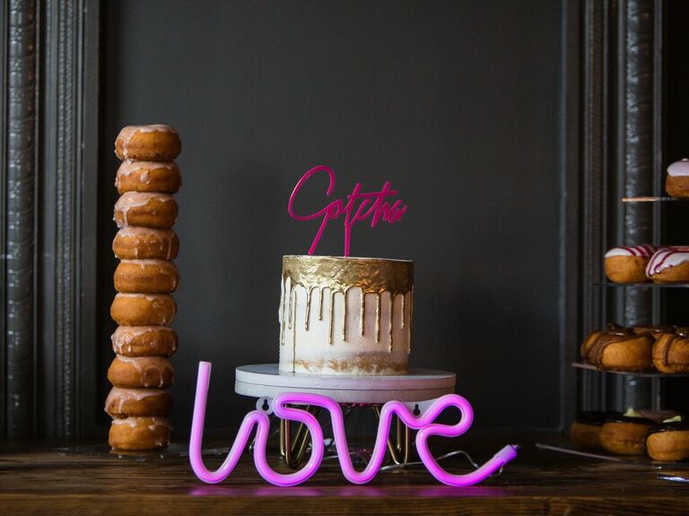 modern one tier wedding cake with neon sign decoration