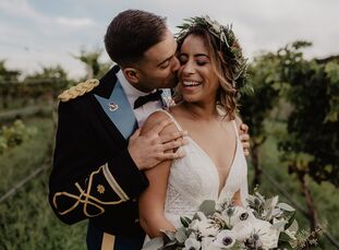 Maddie and Ernesto describe their vineyard wedding as "moody boho-chic." They took advantage of their Labor Day weekend date to incorporate fall-inspi