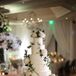 Tall Tiered Round Wedding Cake with White Roses and Vine