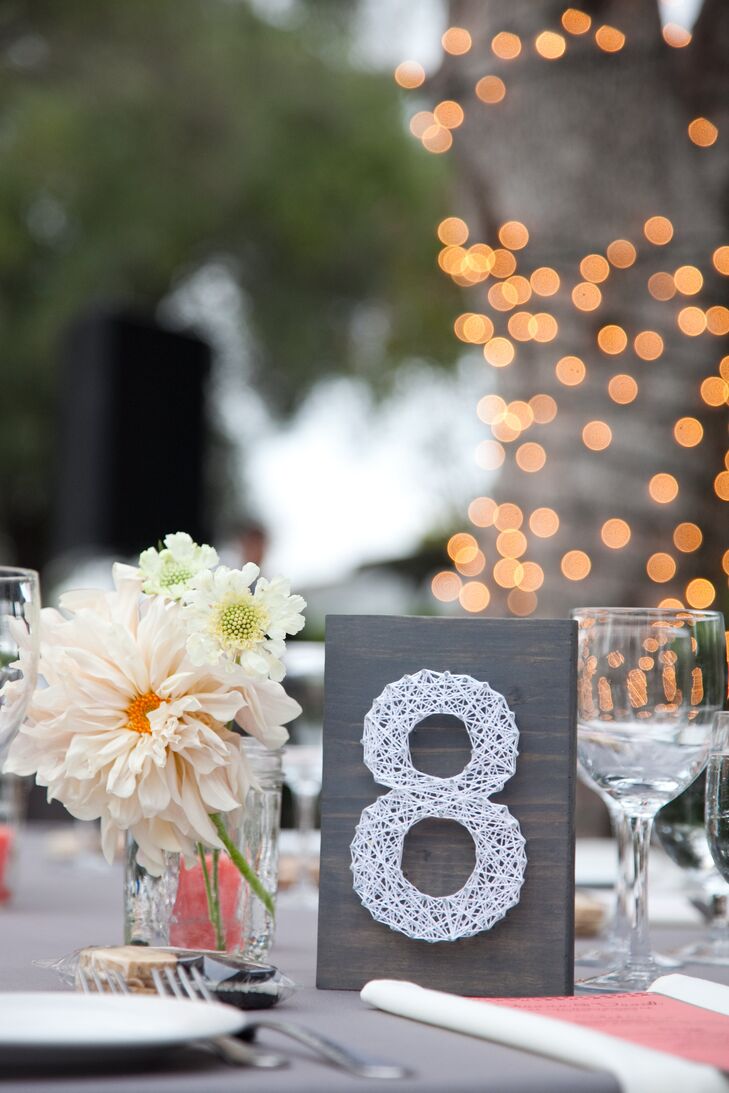 Their planner made the string-art table numbers herself!
