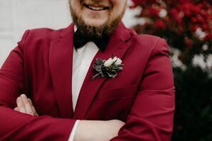 Groom in Burgundy Suit with Black Bowtie